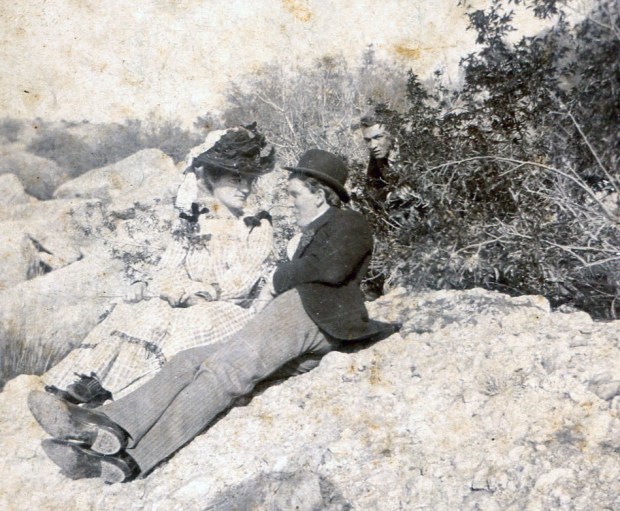 couple with visitor in the background