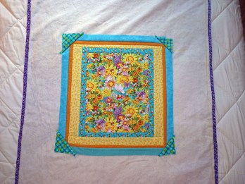 crib quilt center