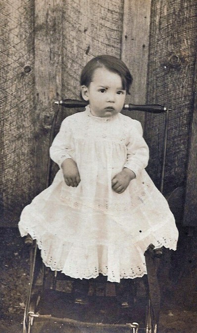 baby in eyelet dress