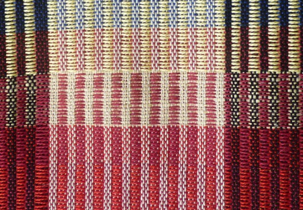 The weft floats don't cover completely, as they did in the sample.