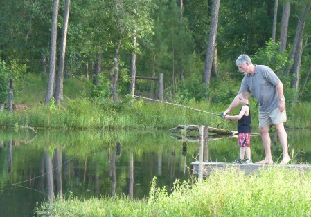 man and boy fishing