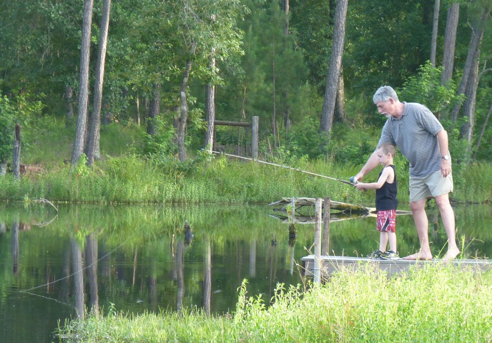 man and boy fishing