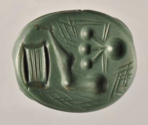 Seal stone.  That looks like a vertical loom on the left.