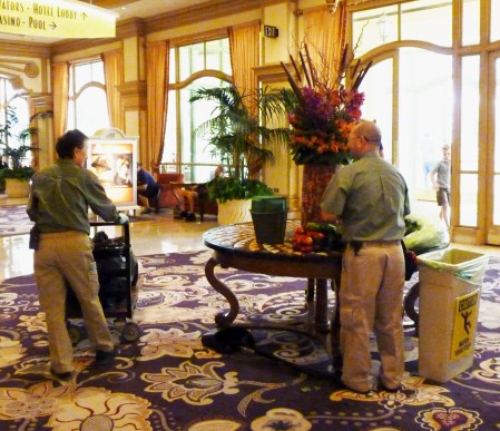 Florists restocking a display.
