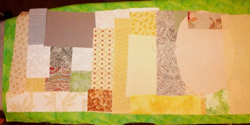 Scraps fused to a background fabric.