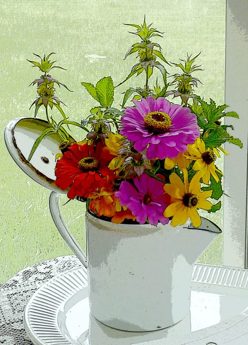 A photo of zinnias with the "poster edges" filter applied.