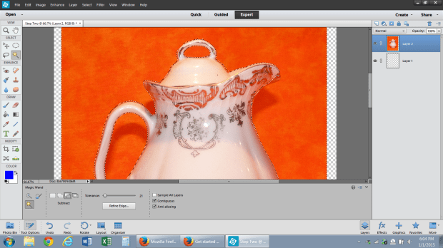 The magic wand tool selects the orange background and separates it from the white pitcher.