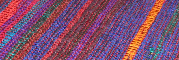 Detail showing the red cotton in the picks between the silk ribbons.