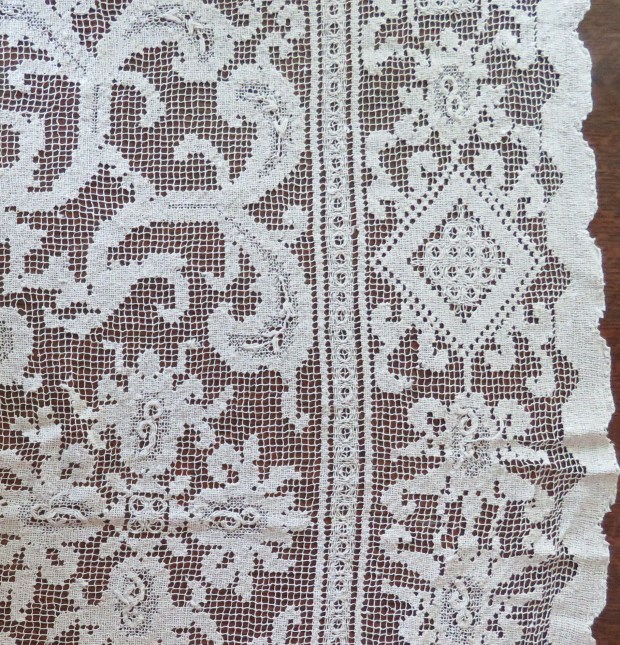 Lacy white tablecloth #1 -- a combination of biomorphic and geometric shapes.