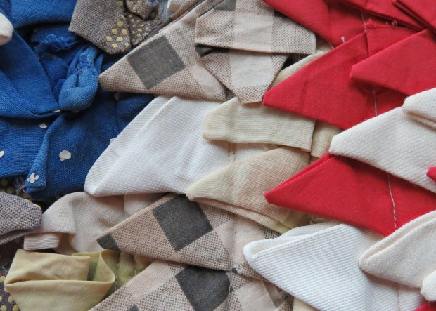 One side has four large areas of red, white, and blue.