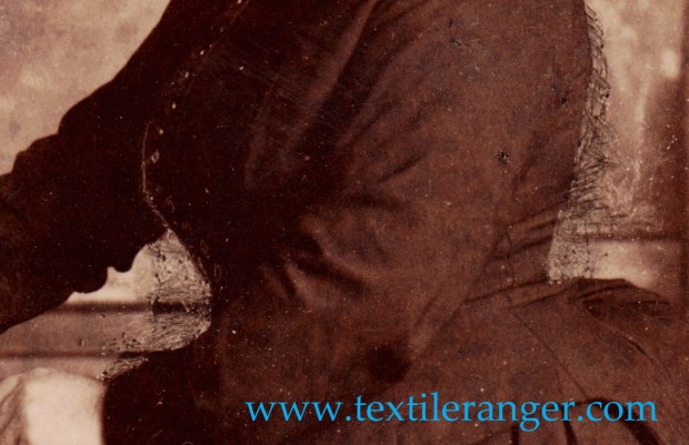 That is not wickerwork behind her, that is some judicious retouching.