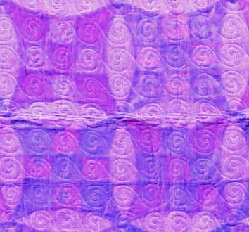 The back, showing the perfect spacing of the machine-stitched spirals. I increased the contrast, the back is a lighter purple.