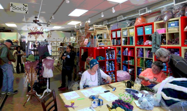 The quintessential yarn shop -- teaching, browsing, reading, and chatting going on in one bright colorful space.