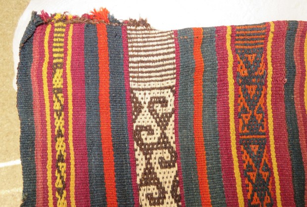 One end of the warp.