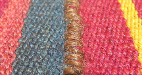 Join between the woven panels.