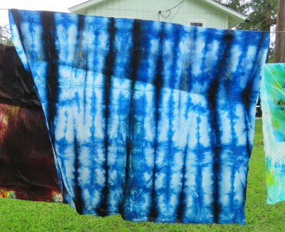 This piece was pleated and then left to soak in a tray of excess dye.