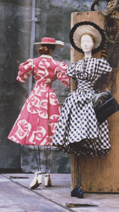 Left, Doll 81 - coat and dress ensemble in pink and white printed linen, designed by Georgette Renal. Right, Doll 74 - dress in navy and white checked twill (synthetic), designed by Molyneux. Photograph by David Seidner.