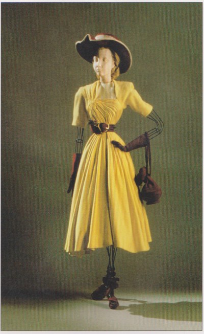 Dress 20 - square-necked draped dress in sulphur yellow (synthetic) jersey, designed by Jeanne Lafaurie, purple suede accessories.