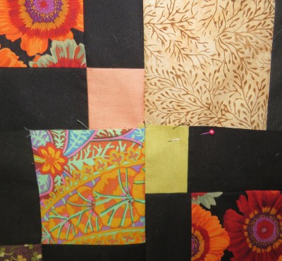 Small salmon-colored piece -- square! Small wheat-colored piece -- not square!