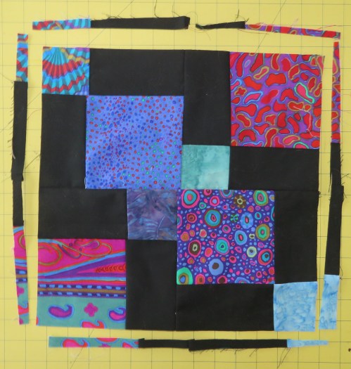 Trimming a little off all four sides gives a more balanced block.