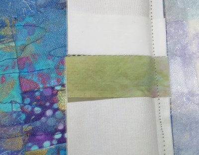 The back of the "fused fiber" edging, showing that it is just printed on cloth.