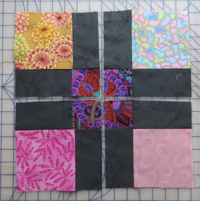Step 1: sew a 9 patch block. Step 2: Cut it in half both horizontally and vertically.