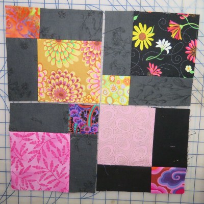 Or even better, if you ask me: swap the cut pieces from various 9-patches, so none of the little squares are the same in the reconfigured block.
