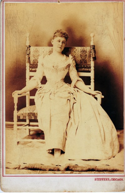 "I declare, I'm laced so tight I can only languish in this chair -- but I do it so beautifully."