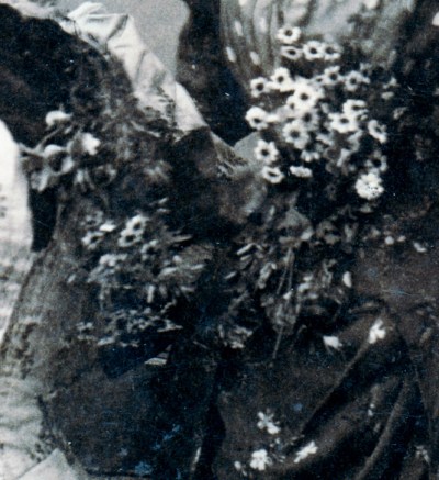 -- There is a lot of blurriness in the middle. Did the girl in the dark dress drop her bouquet? Is it some kind of sheer shawl?