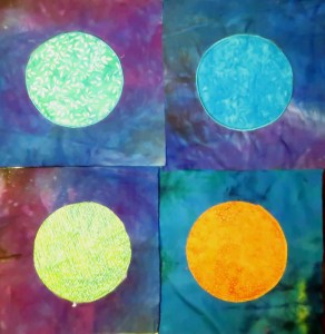 Four planet blocks, just laid down together, not yet stitched together.