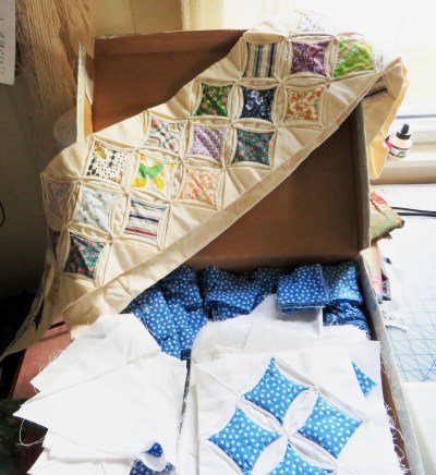 Some cathedral window blocks.