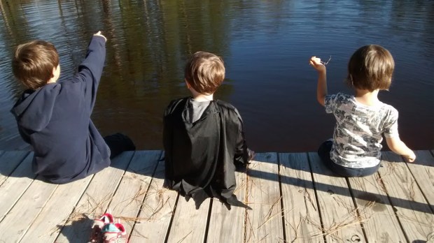 Batman in the middle. There may be a Teen-age Mutant Ninja Turtle shell under the cape as well.