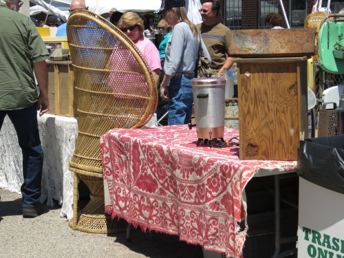 antique coverlet topped with stuff for sale
