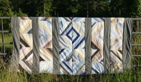 string quilt on fence