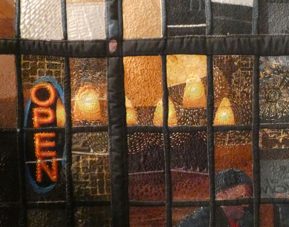 detail of quilt showing urban glass walls