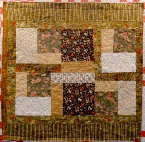 scrappy lap quilt in autumn colors