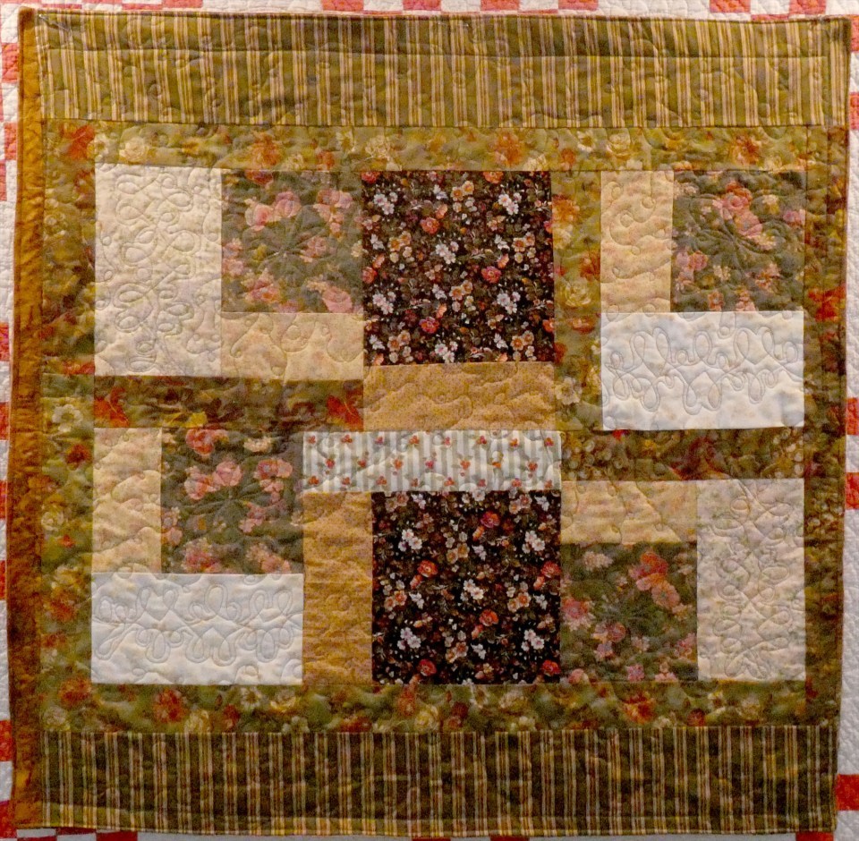 scrappy lap quilt in autumn colors