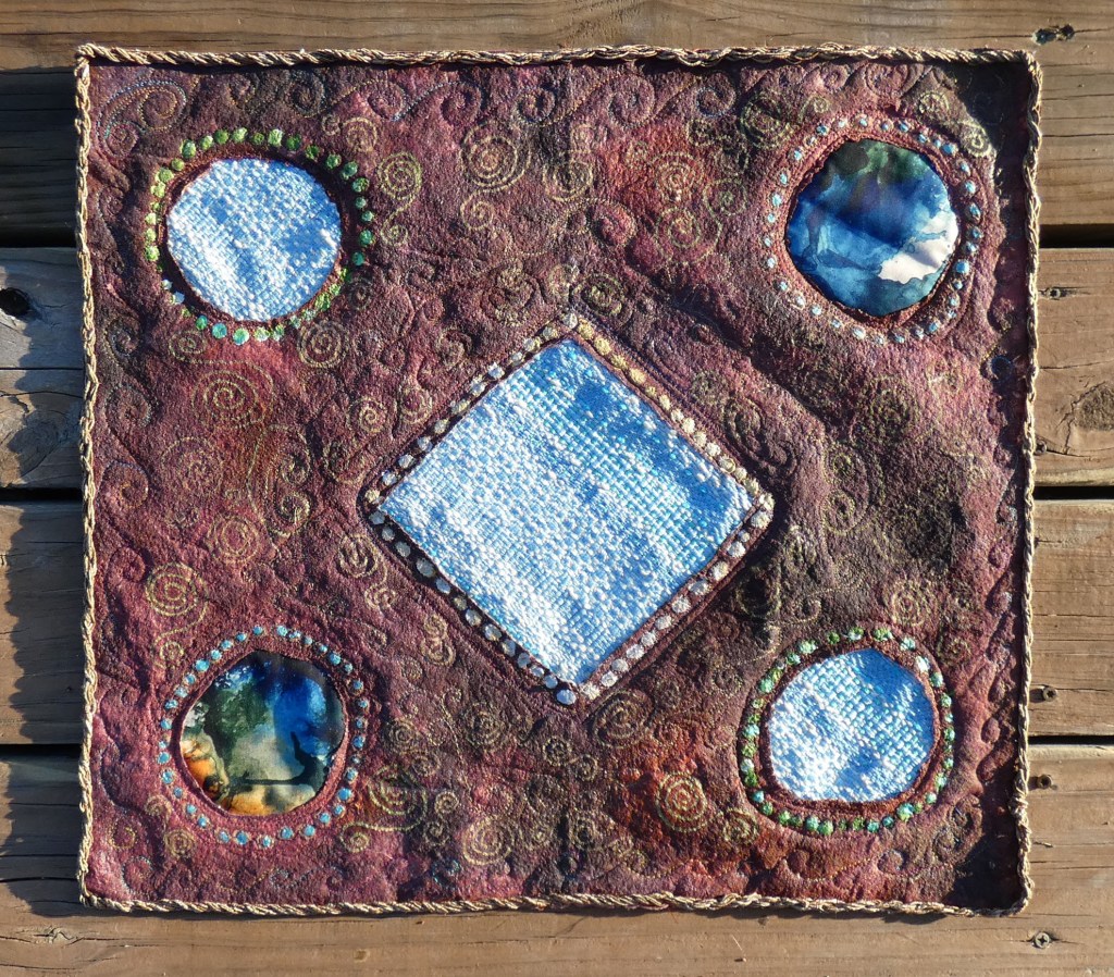 small art quilt with painted batting, handwoven fabric elements