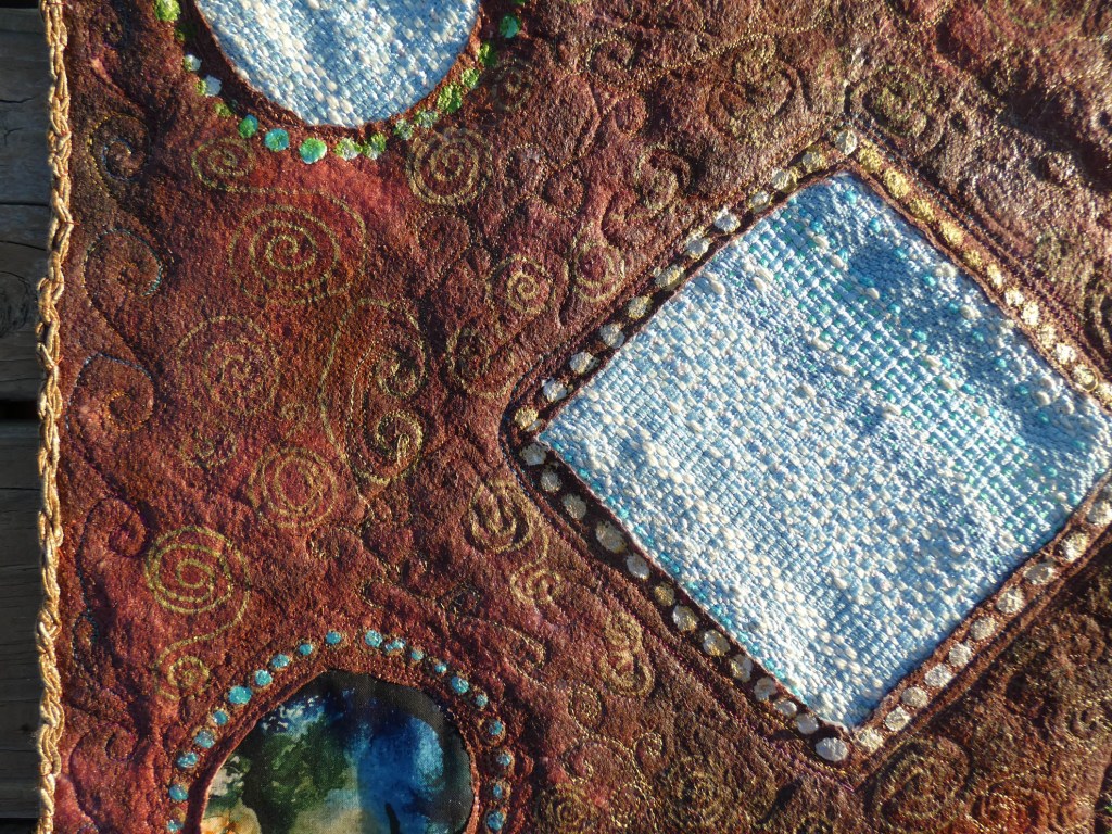 painted batting with fabric elements, marker drawing