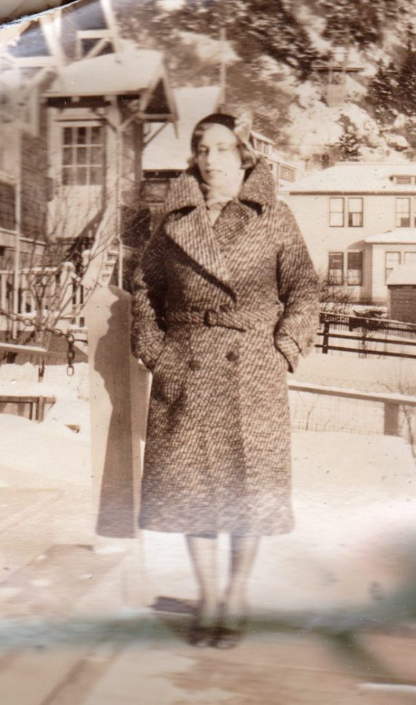 woman in double-breasted coat, Alaska, 1930s