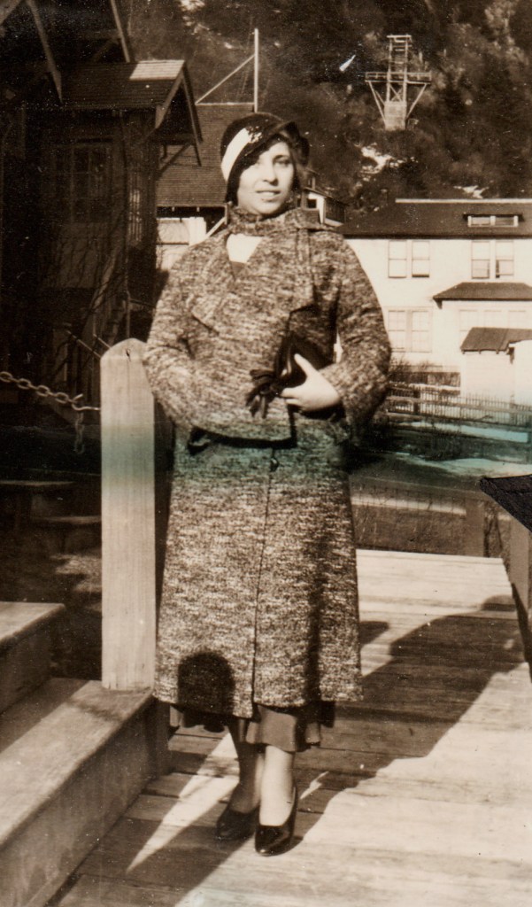 woman in coat with accessories, 1930s